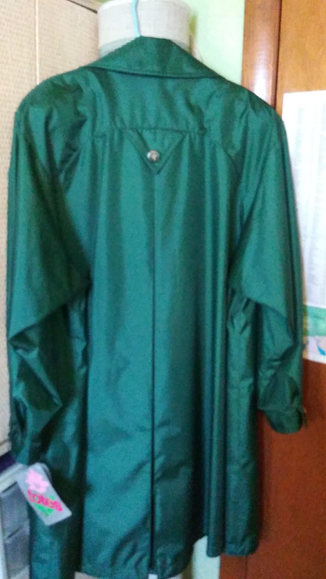 Totes raincoat size 10 dark green. Brand new.