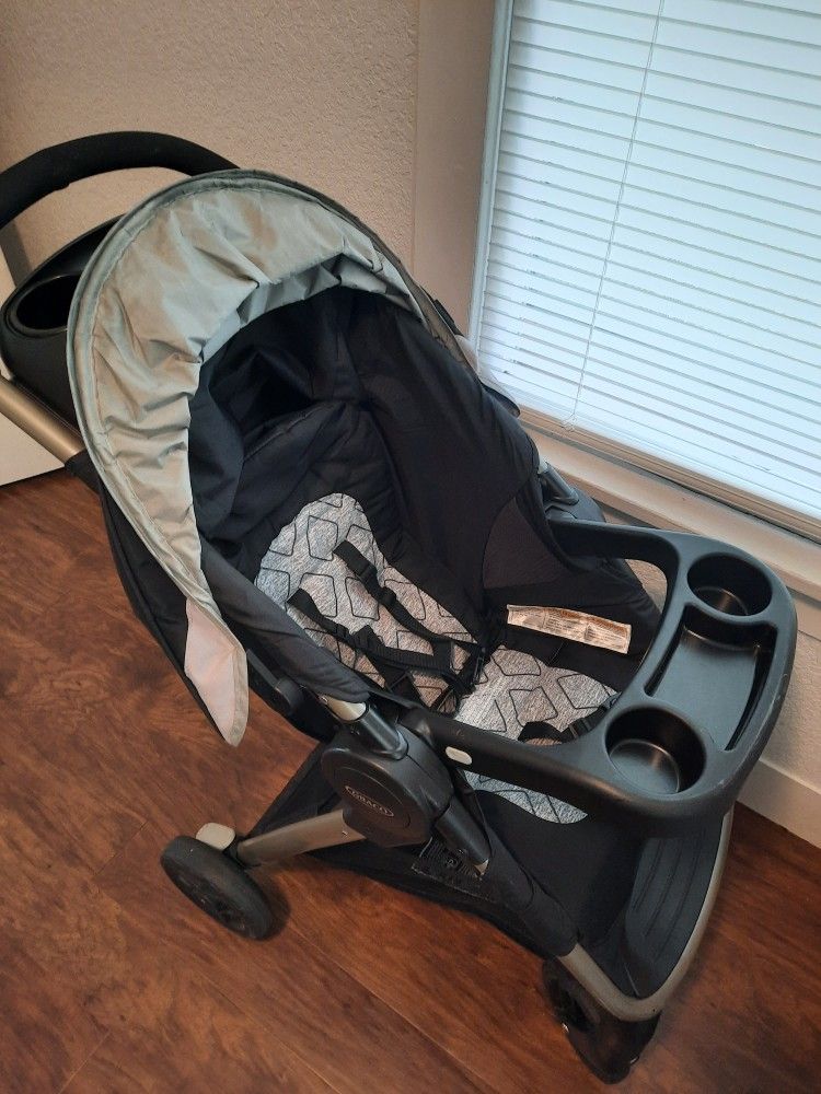 Graco FastAction Fold SE Travel System With SnugRide Infant Car Seat And Stroller