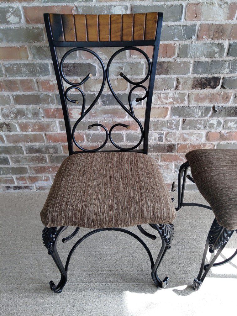 Two Metal Chairs With Fabric Seats And Wooden Back Accents