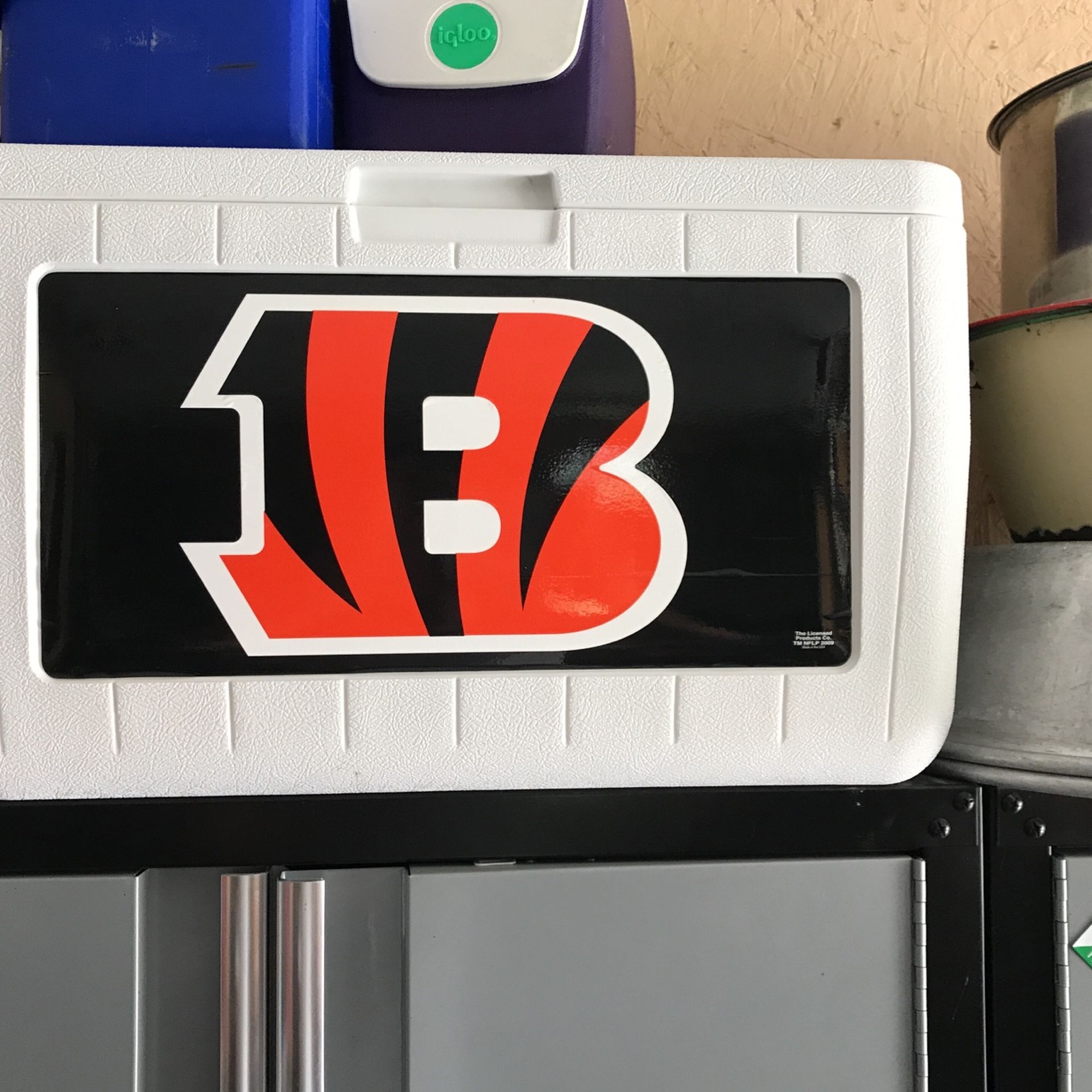 Cincinnati Bengals cooler, made by Coleman white with Cincinnati Bengals logo and drain plug in end