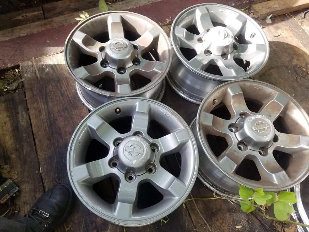 SET OF 4 OEM NISSAN FRONTIER RIMS "15" INCH WHEELS 6 LUG PATTERN. 6 lug