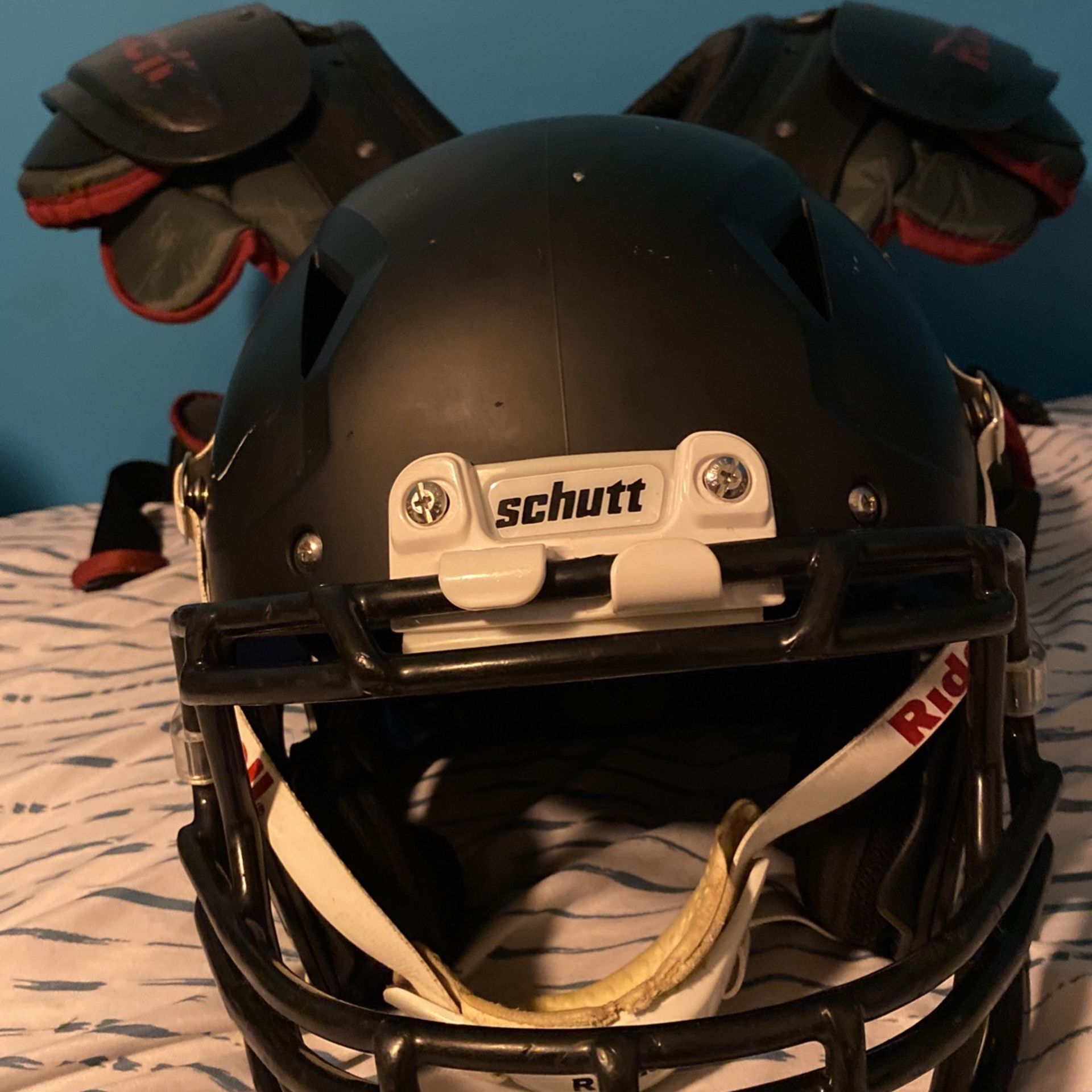 youth football helmet and shoulder pads