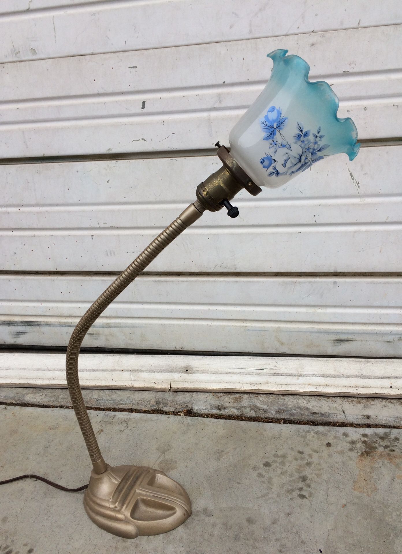 Desk lamp with blue flowered glass