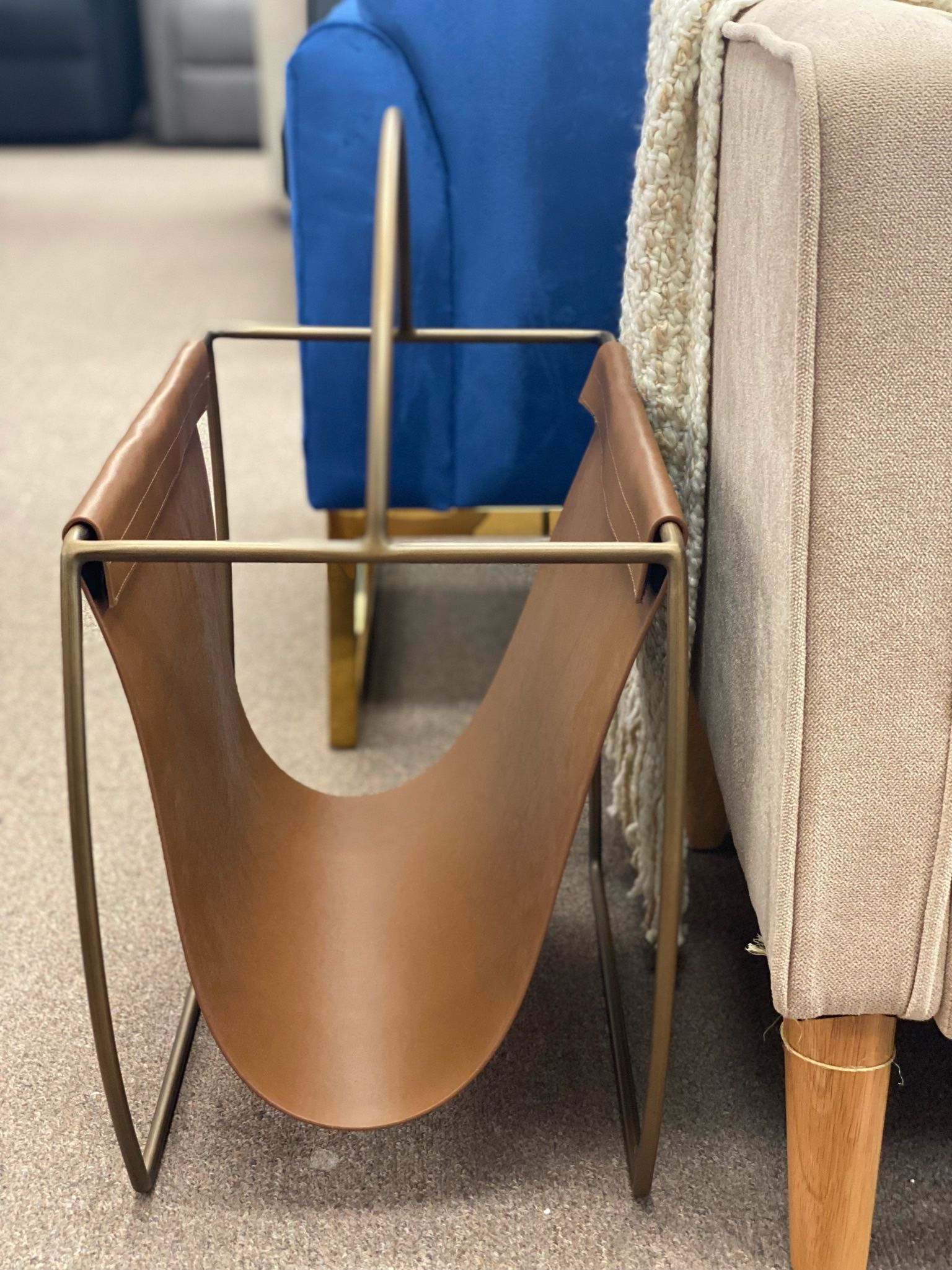 Hardage magazine rack by Mercury Row. Overall: 23” H x 22” W x 10” D. Faux leather. MSRP: $300. Our price: $95 + Sales tax