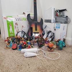 Wii with games and guitar Thumbnail