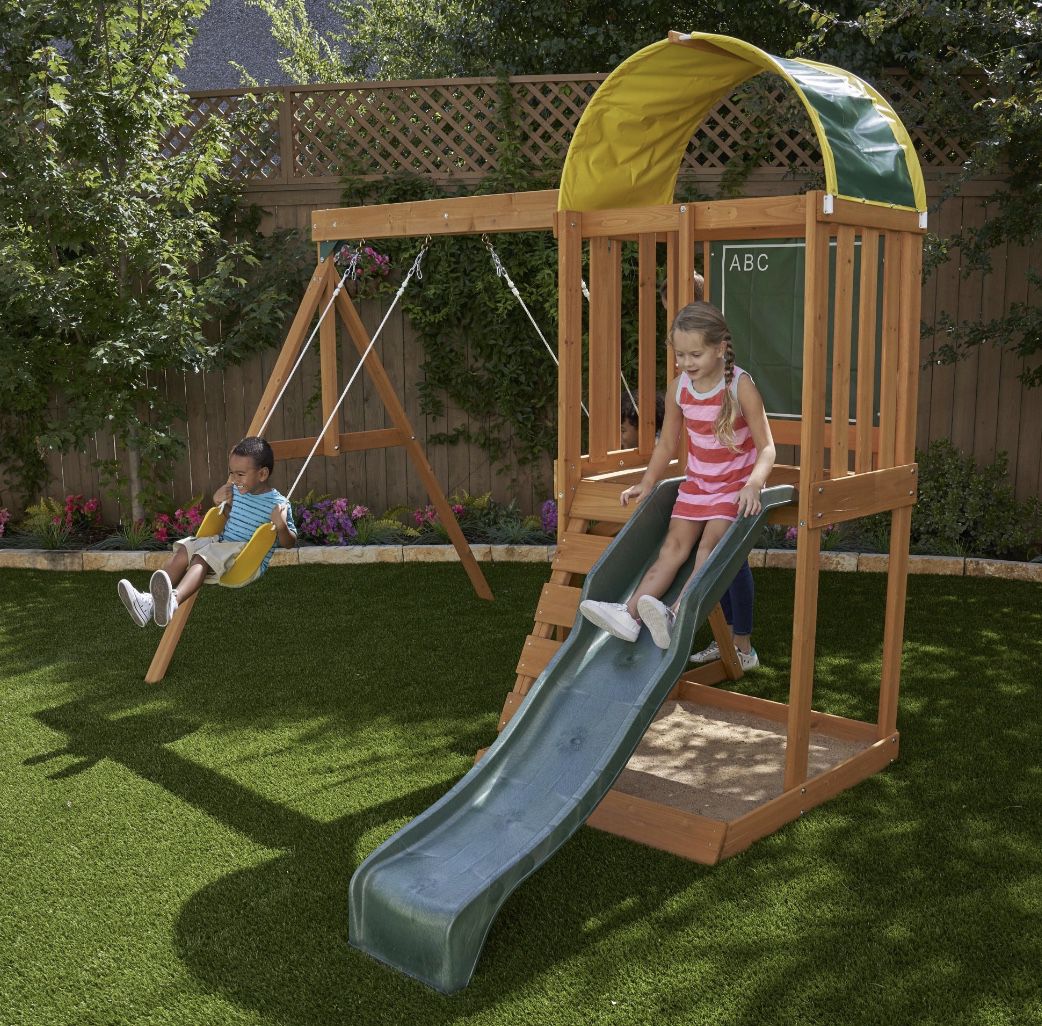 KidKraft Ainsley Wooden Outdoor Swing Set with Slide, Chalk Wall, Canopy and Rock Wall