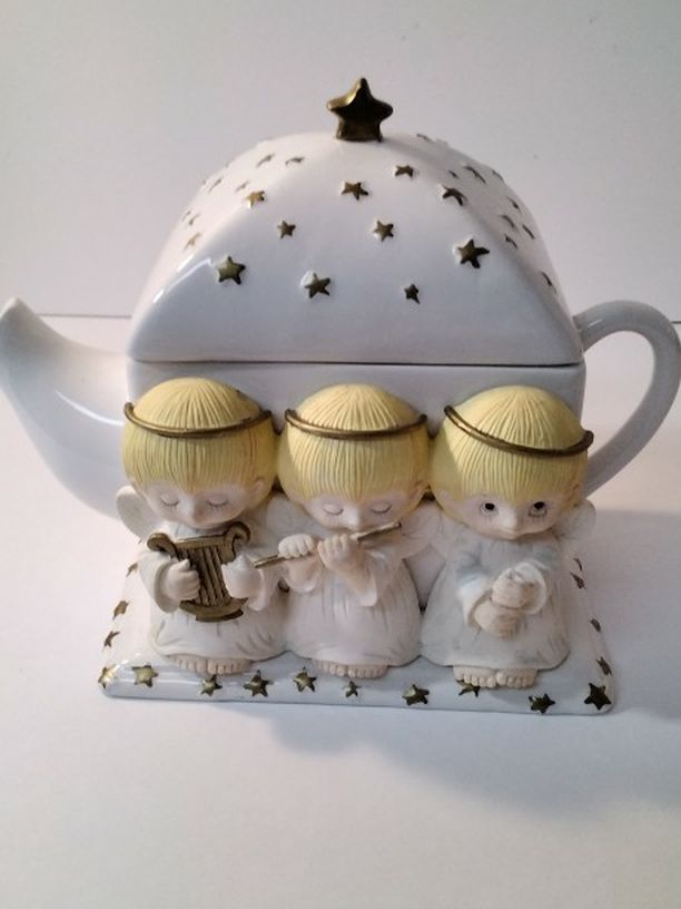 A Beautiful Tea Pot With Angels .