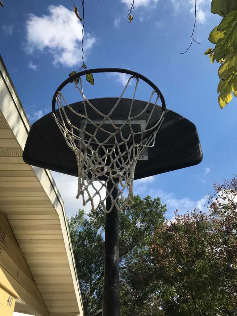 Trampoline And Basketball Hoop