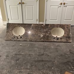 Brown marble top with ivory sinks. 79 inches wide. Thumbnail