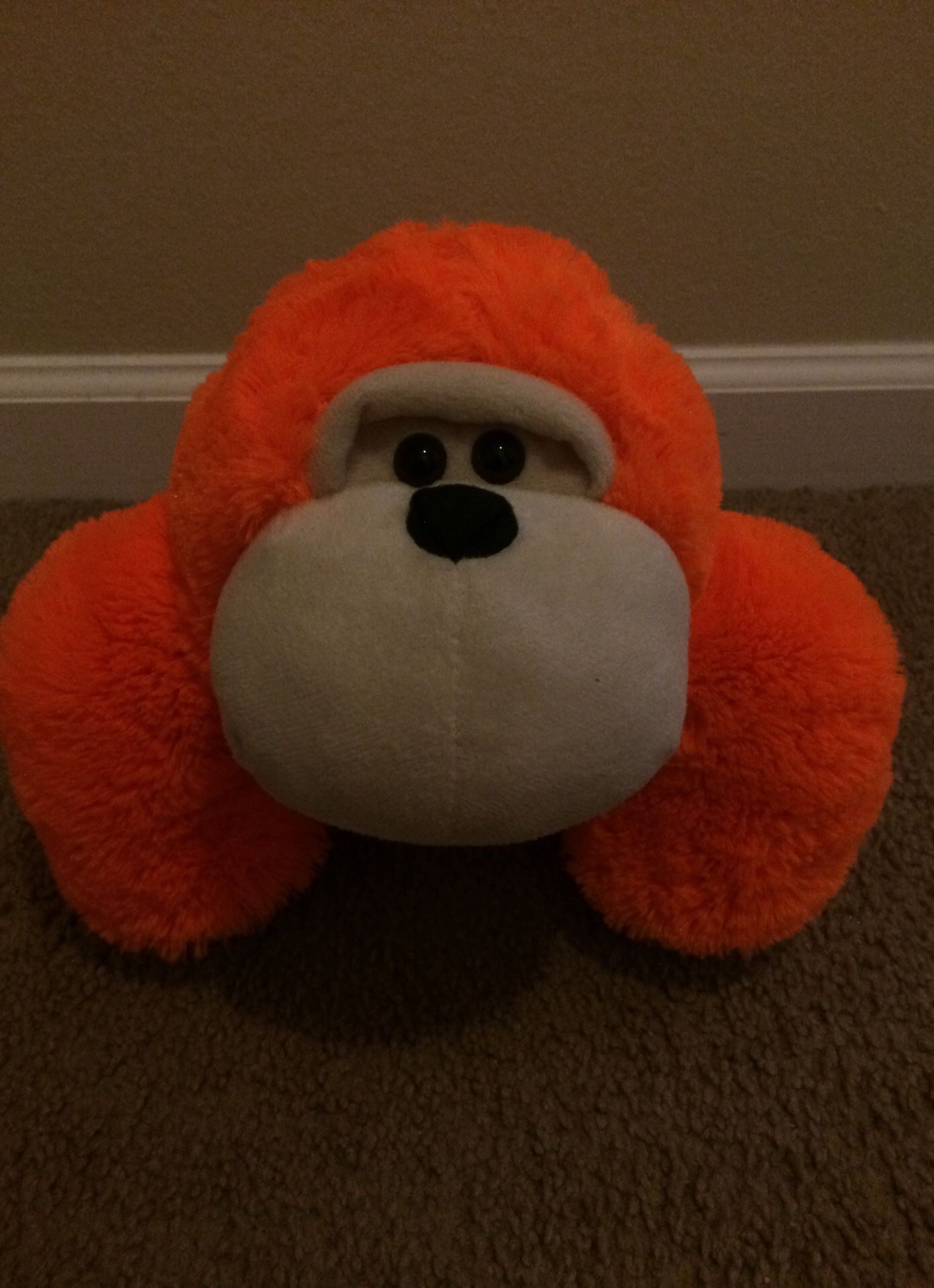 Orange monkey stuffed animal toy