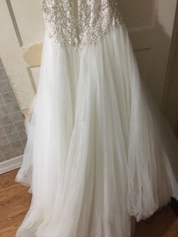 Size 8 Maggie sorrento wedding dress. Gold/ivory. Sweetheart neckline. Long train. Used in mint condition. Thumbnail