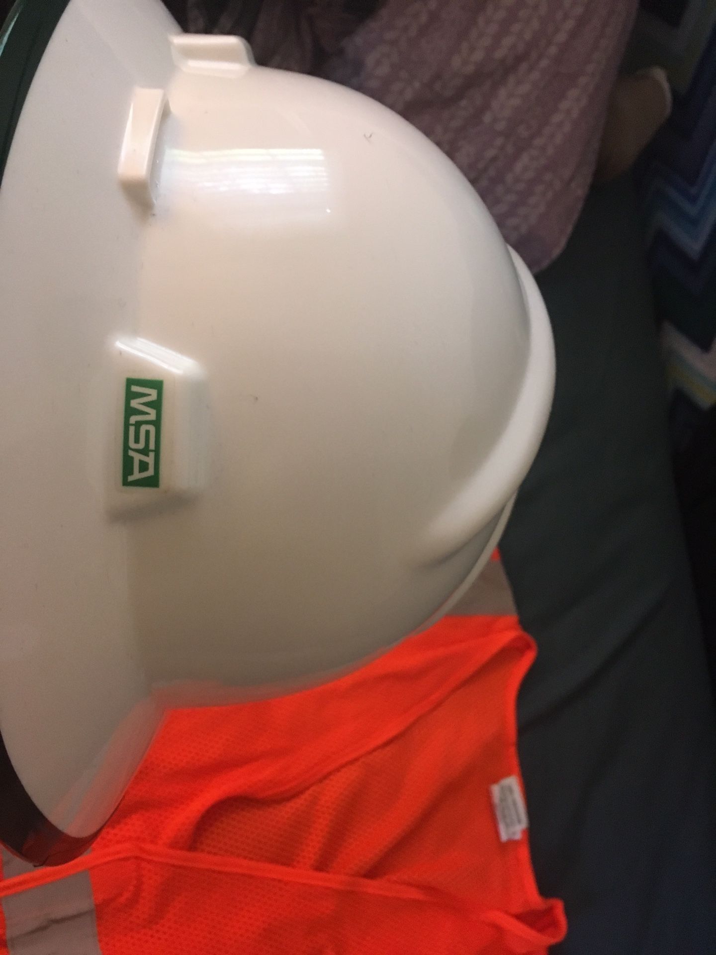 Safety helmet, reflective vest and safety glasses