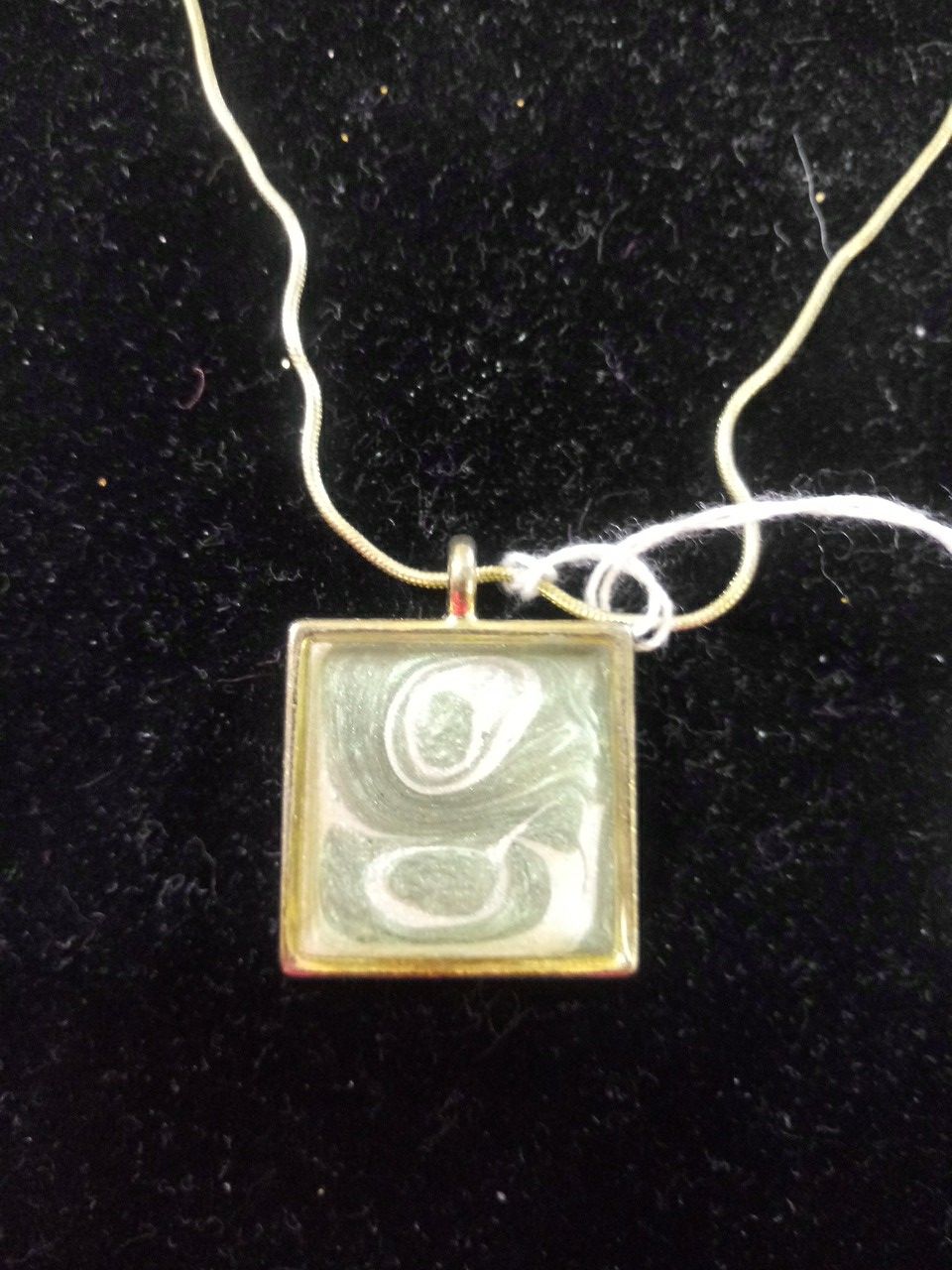 Hand painted green and pearl pendant on gold tone snake chain.