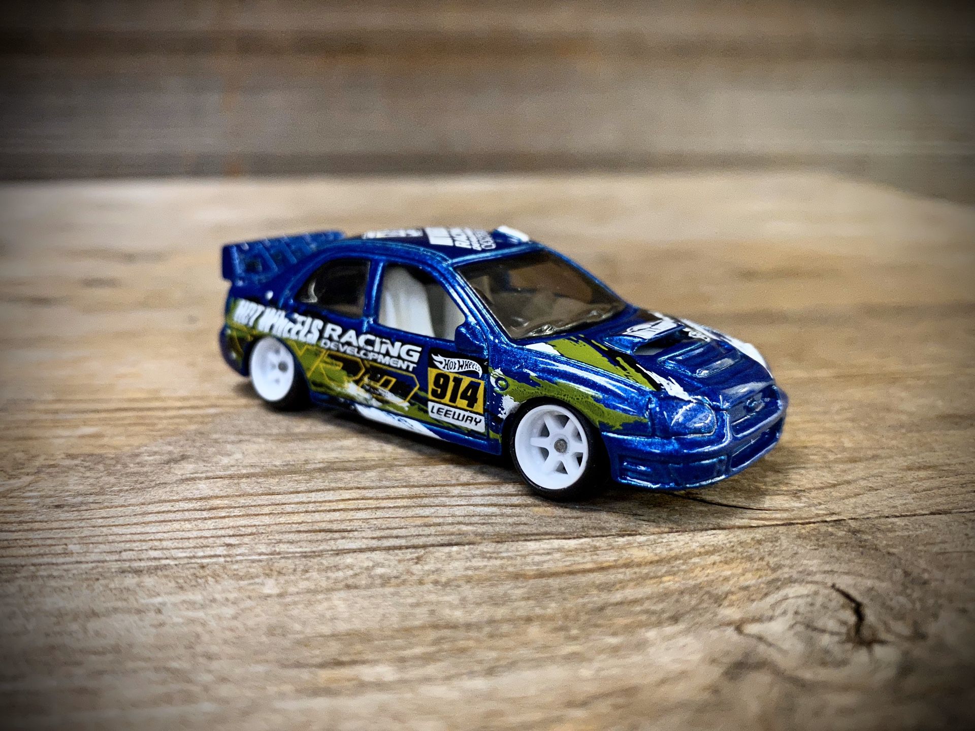 REPACKAGED CUSTOM 1:64 Subaru Impreza WRX - Hot Wheels (Lowered + camber with upgraded premium 7-spoke white wheels)
