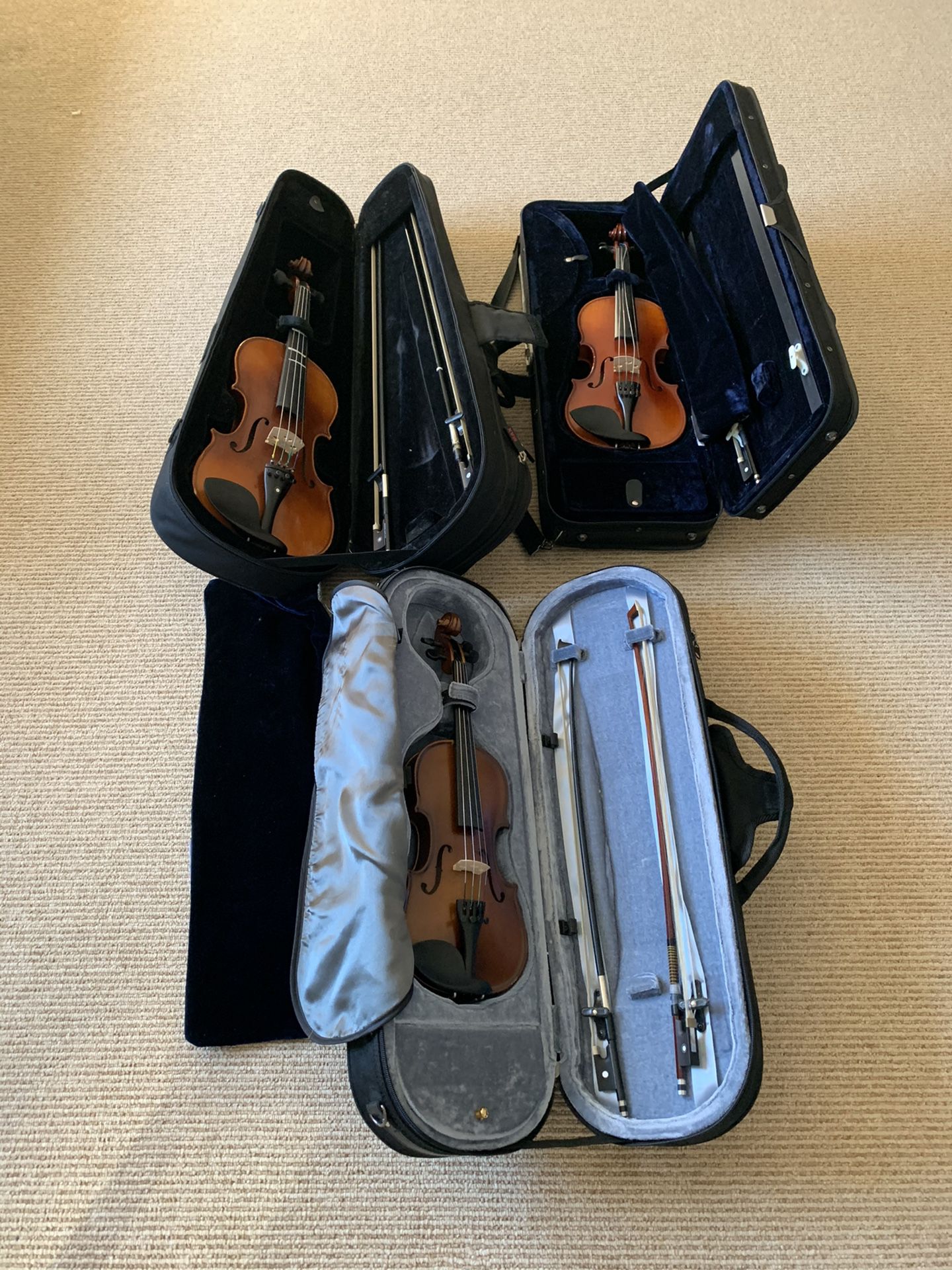 Three different size of Violins (1/4, 3/4, and 4/4) including Bows and Cases