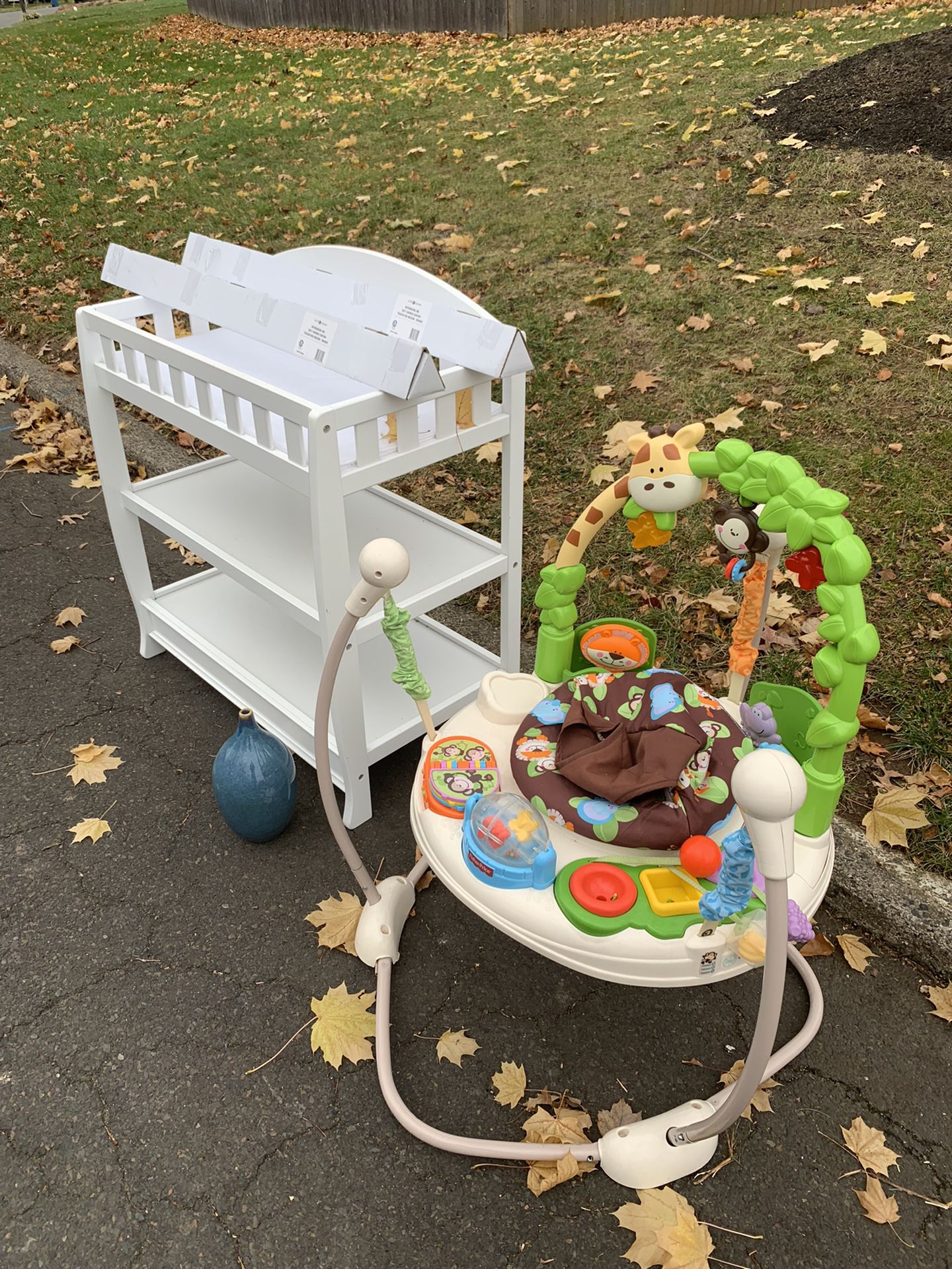 Free Changing Table, Bouncer, Vase, and 2 Curtain Rods 