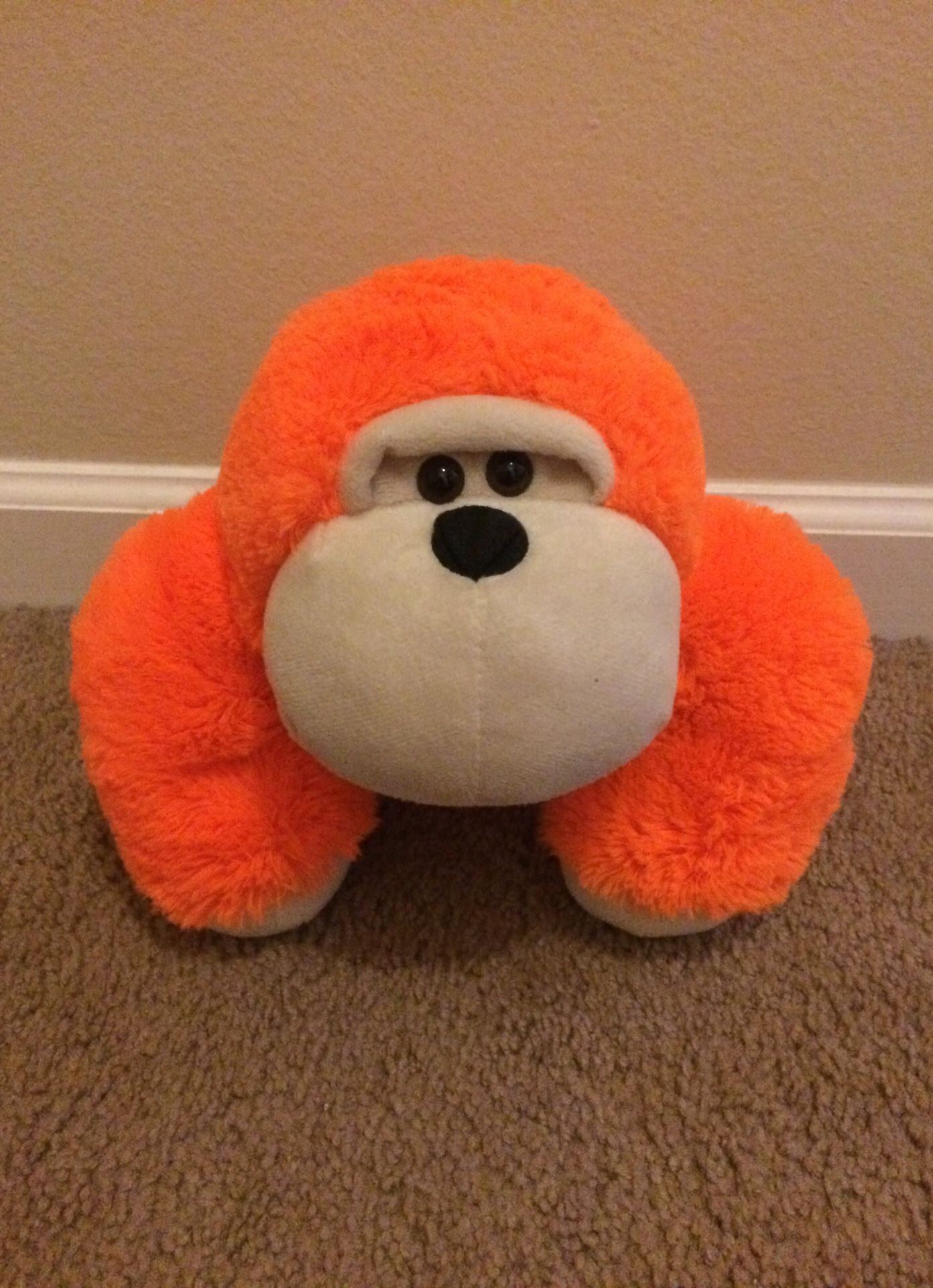 Orange monkey stuffed animal toy