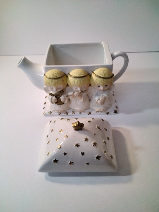 A Beautiful Tea Pot With Angels .