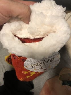 Harry Potter one size fits ok gryffondor house with the logo at the bottom . With the lion in the middle never worn selling for less than half retail Thumbnail