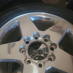rim with everything and tire for chevy silverado with 8 lugs in very good condition Thumbnail