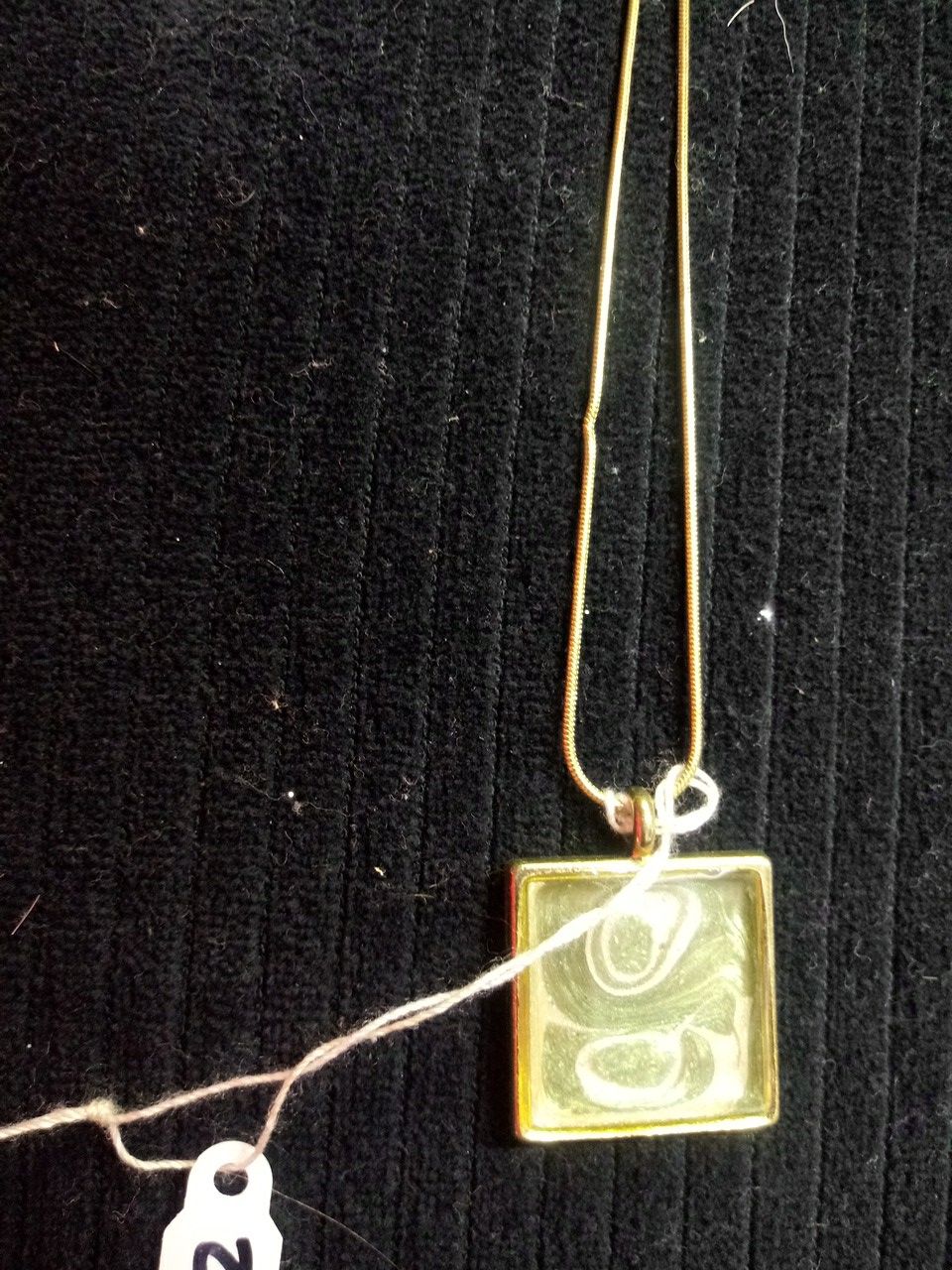 Hand painted green and pearl pendant on gold tone snake chain.