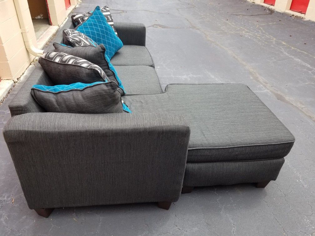 Nice Charcoal Gray Sectional w/ Grey and Blue Pillows