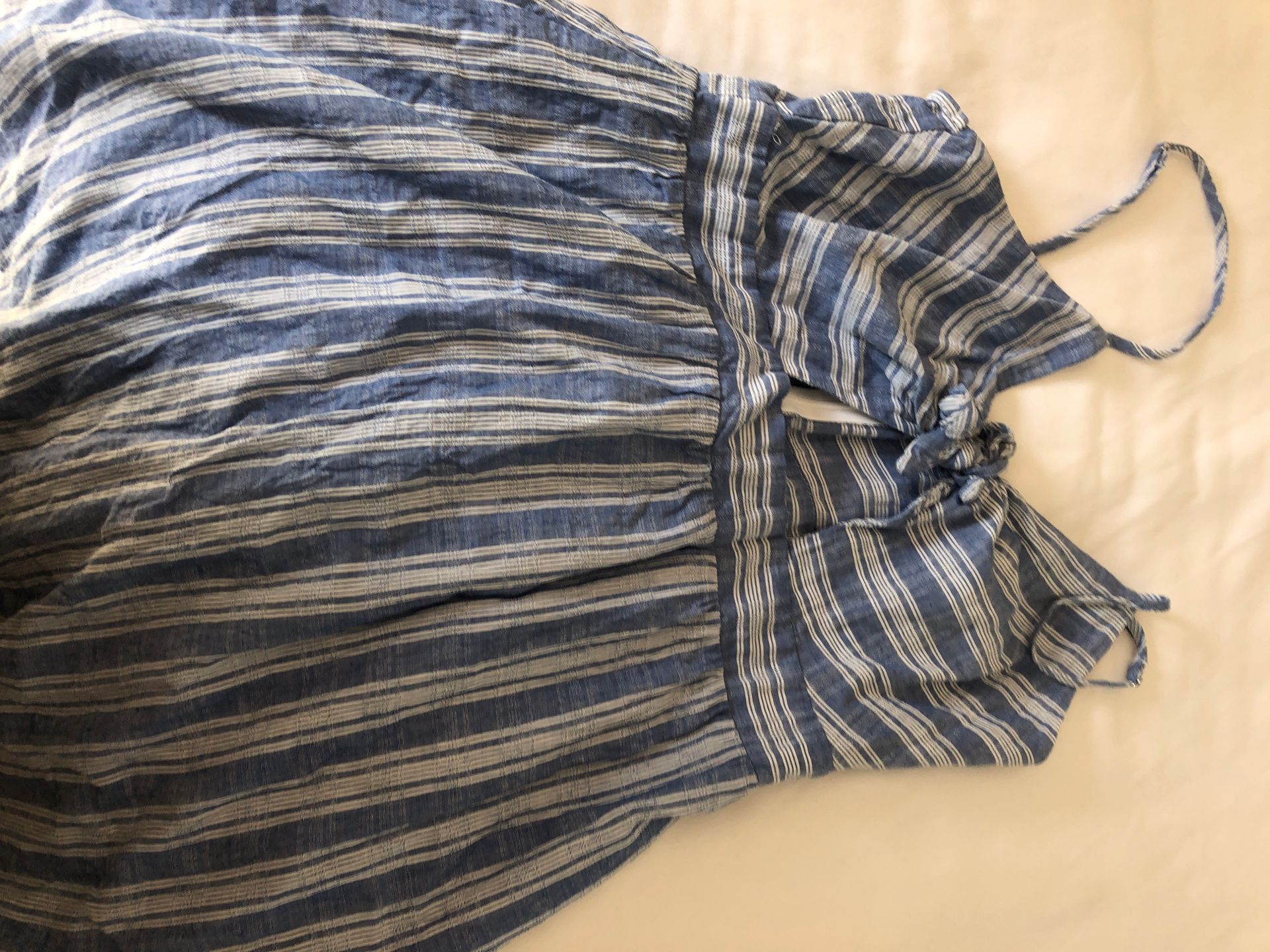 Classy or casual blue and white stripped sundress with cutout in front. Size 4-6