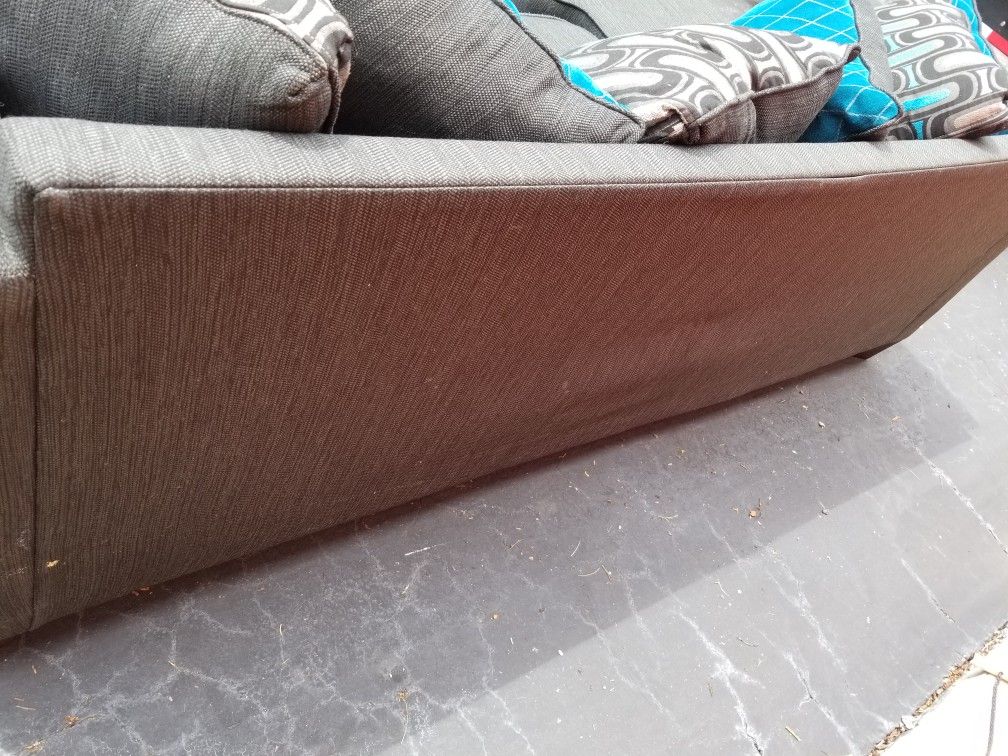 Nice Charcoal Gray Sectional w/ Grey and Blue Pillows