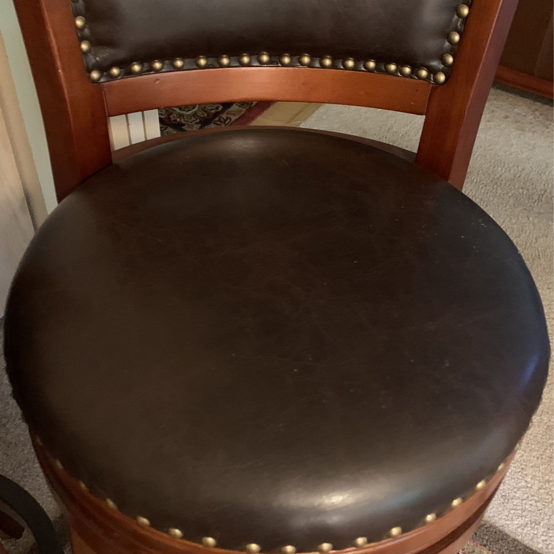 Swivel Bar Stools Black Leather+Cherry Wood+Brass Tacks . Floor to Seat 29”. Floor to top Of The Back 42”.