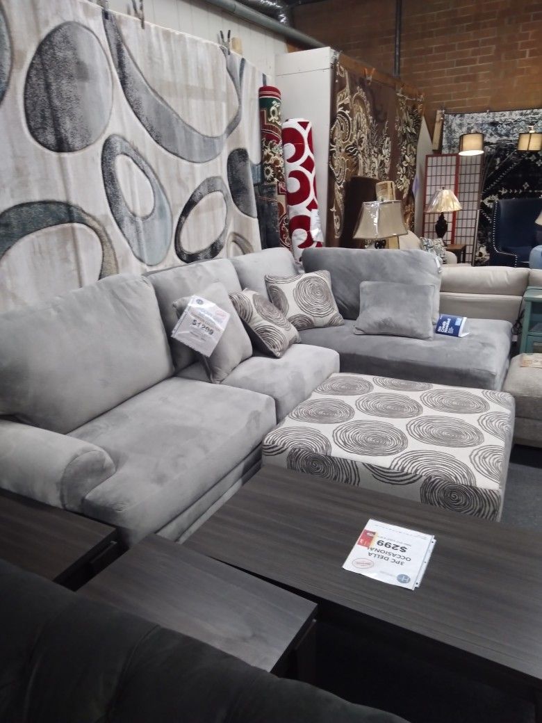 Groovy Grey Sectional And Ottoman