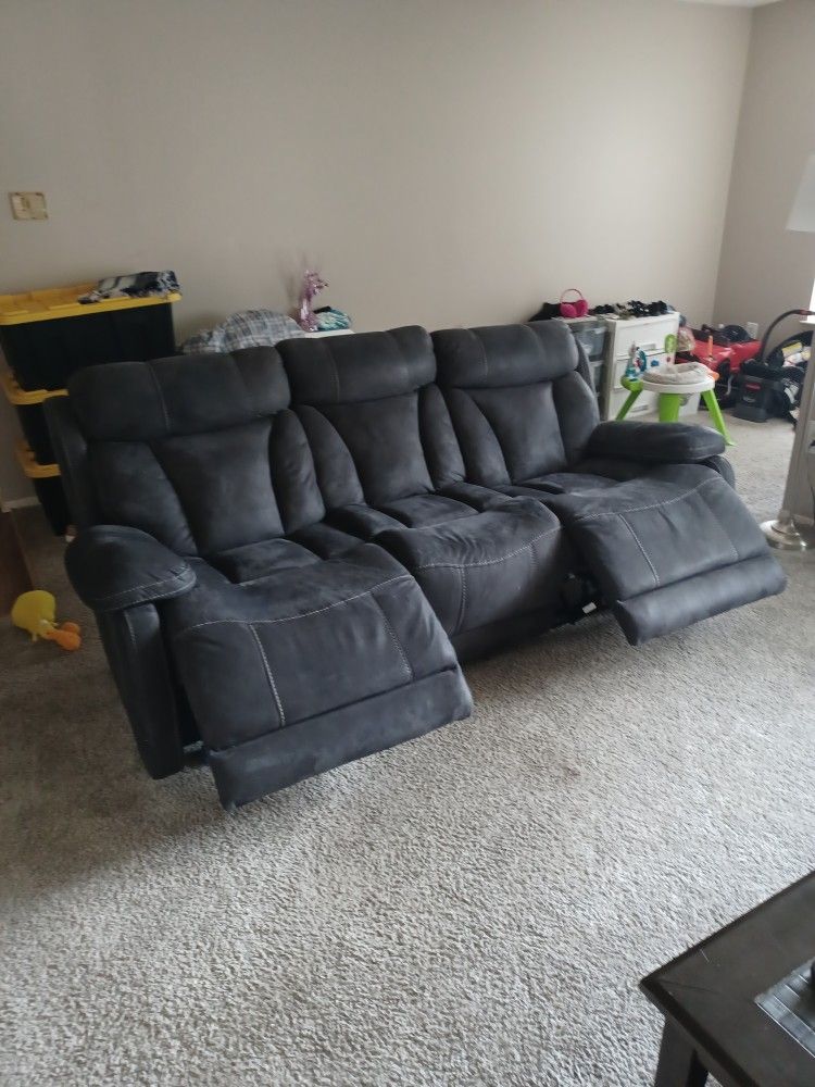 Reclining Couch With Charger Plugs. Cocktail Table