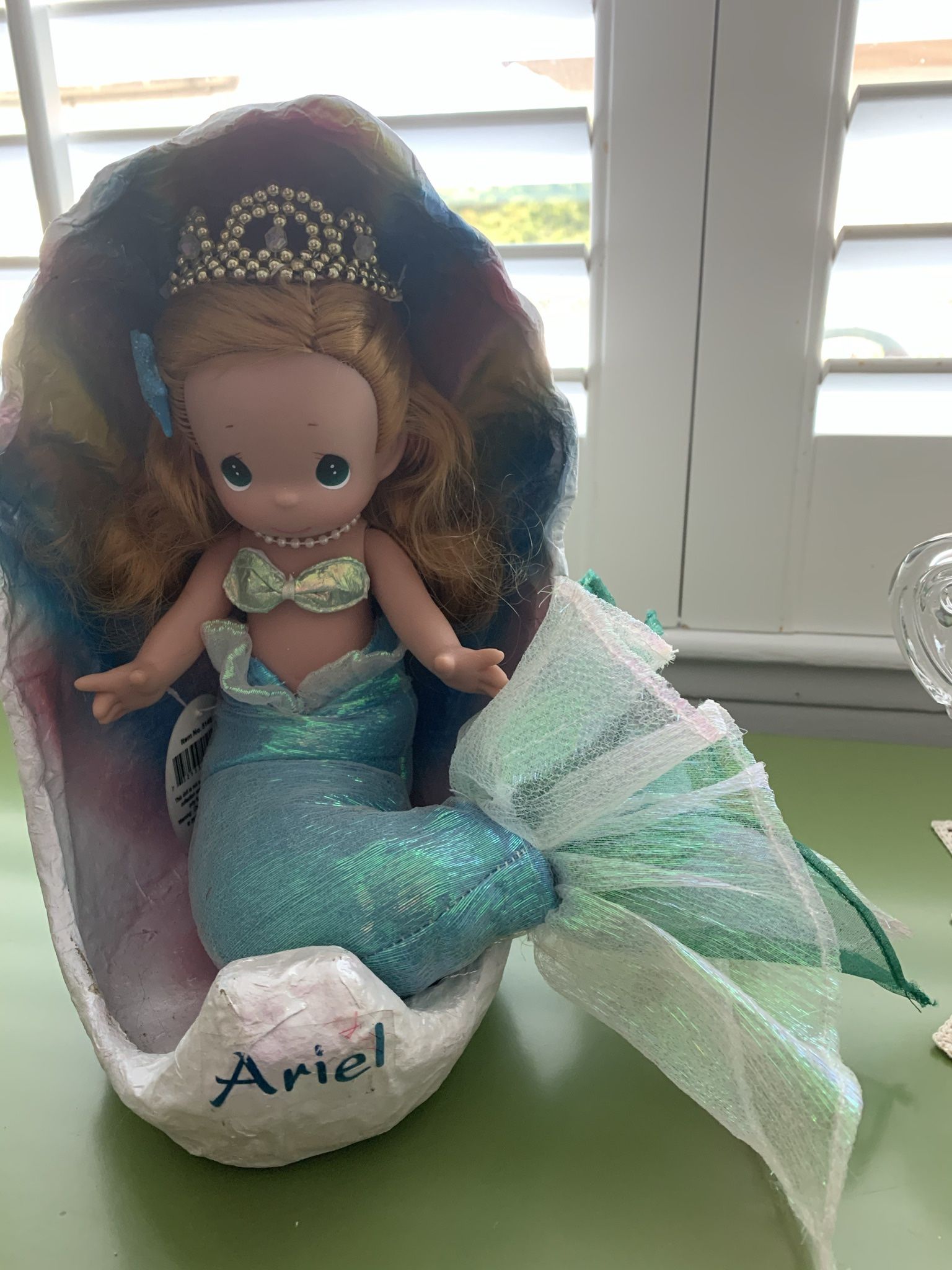 Disney Precious Moments Ariel in shell doll. Soft body and vinyl head and arms. Approx 10”H. She is in excellent condition.