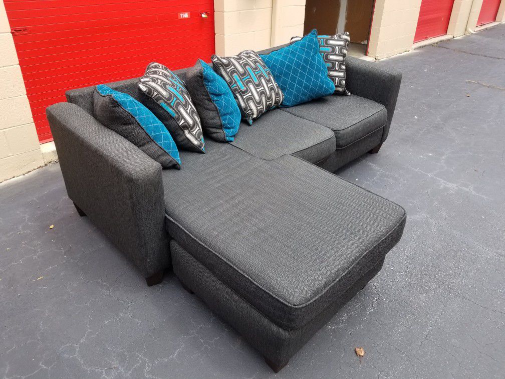 Nice Charcoal Gray Sectional w/ Grey and Blue Pillows