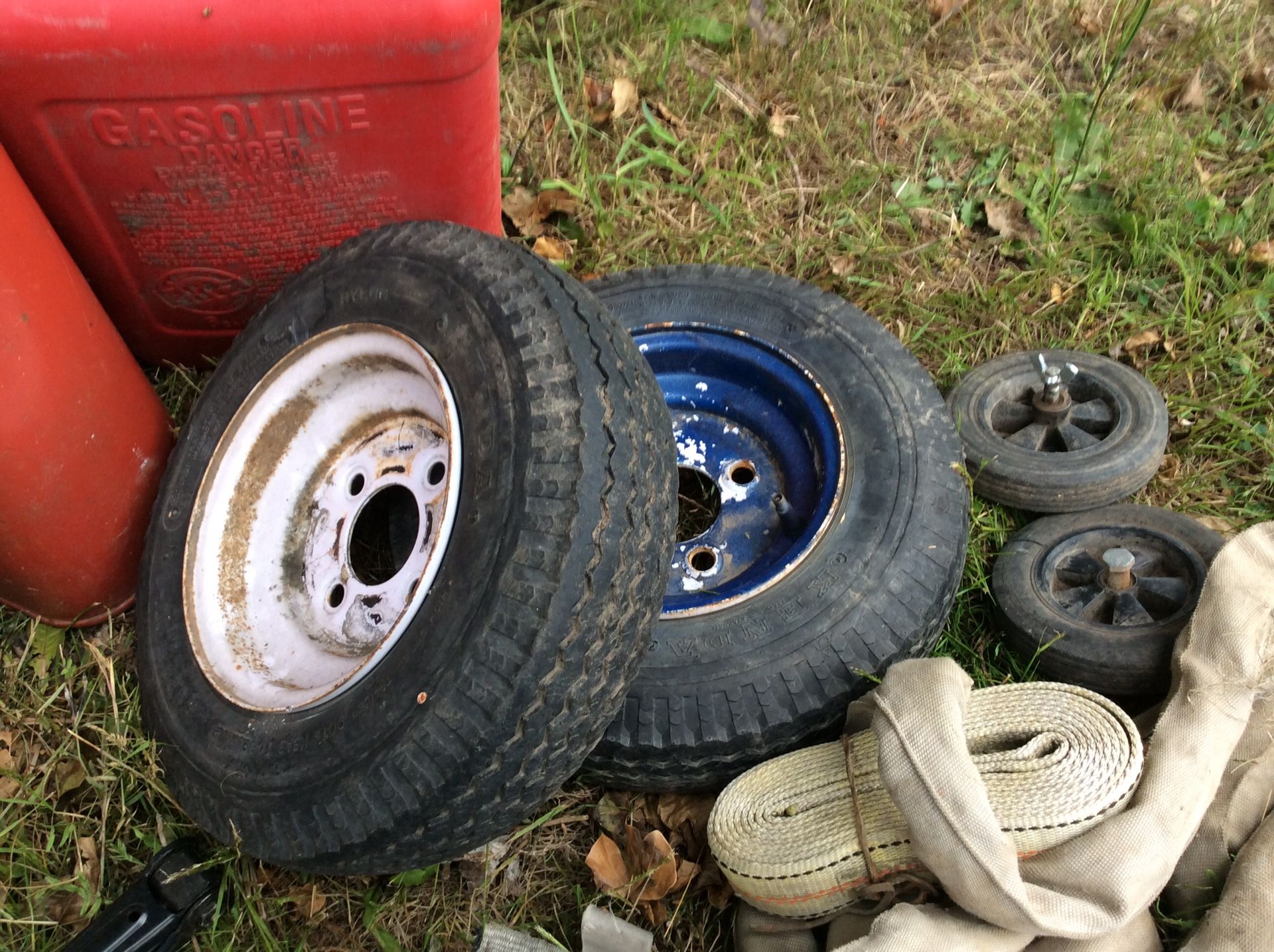 Gas can lot, tow straps, car jacks, trailer tires(2), tow hitch