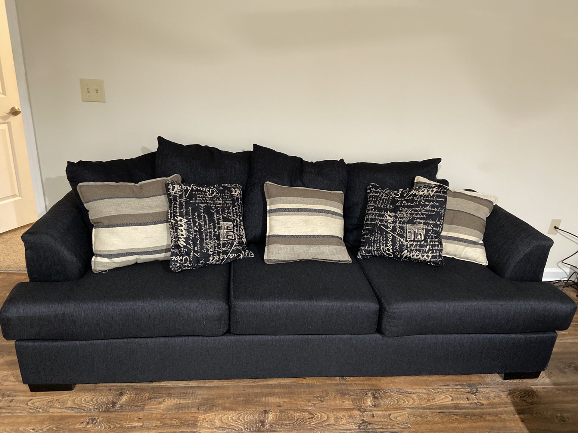 Navy blue couch. Pillows included. Love seat available as well