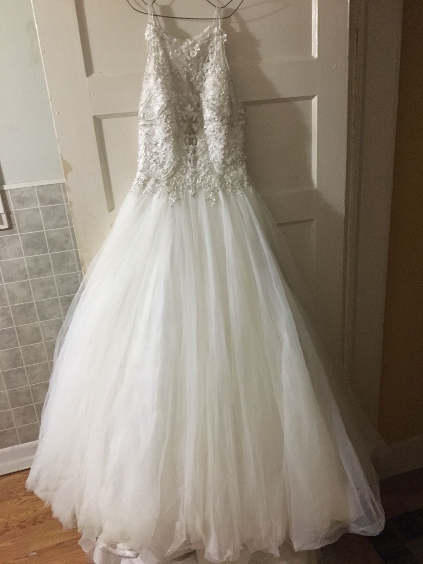 Size 8 Maggie sorrento wedding dress. Gold/ivory. Sweetheart neckline. Long train. Used in mint condition.
