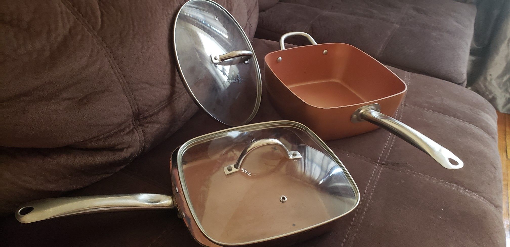 COPPER CHEF FRYING PAN ,DEEP SQUARE HOLDS 4.5 QUART PAN POT, 2 LIDS COOK OVER GAS, ELECTRIC I WOULD ALSO PUT THEM IN THE STOVE WITHOUT LIDS.