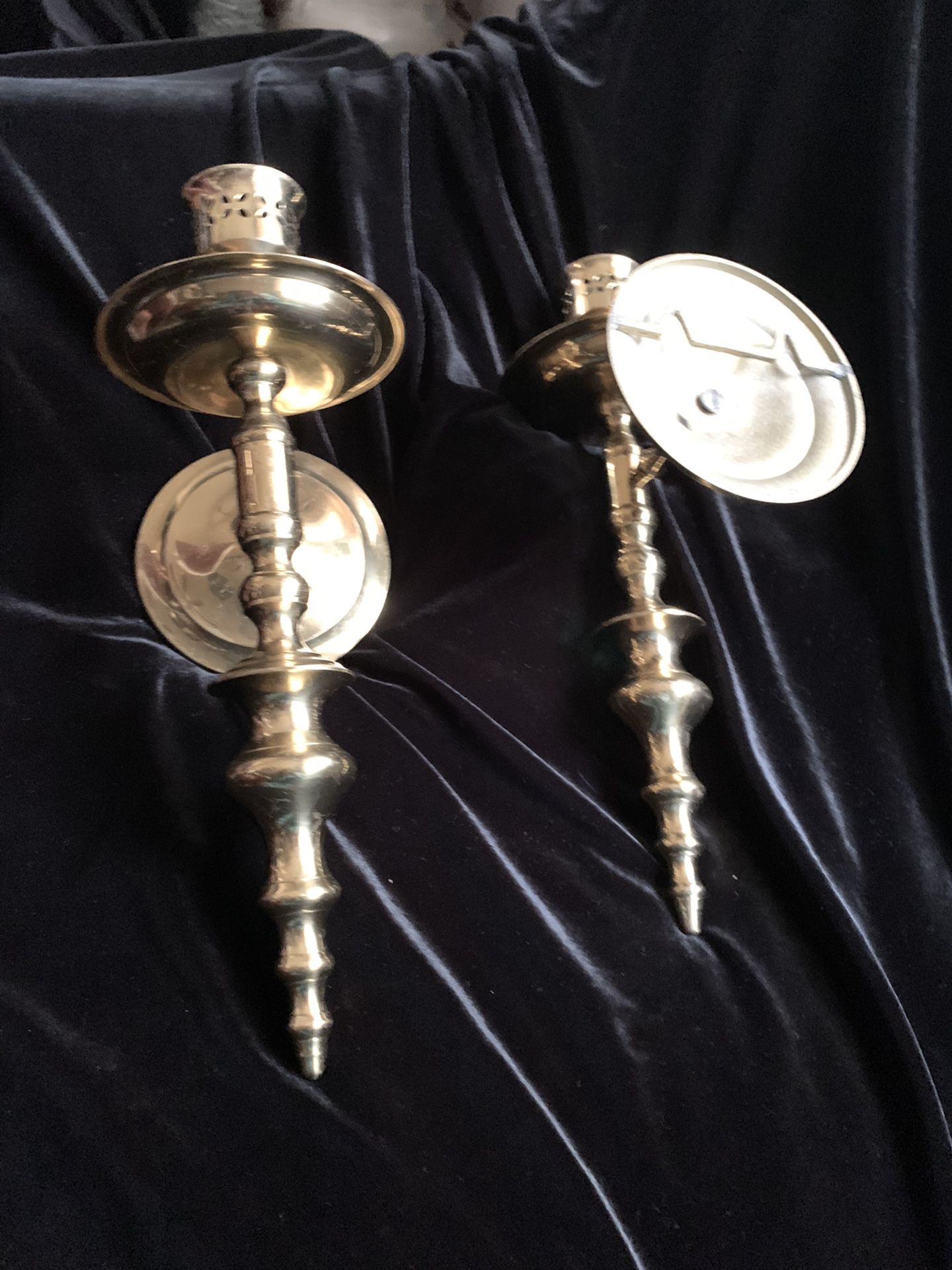Brass wall candle holders.