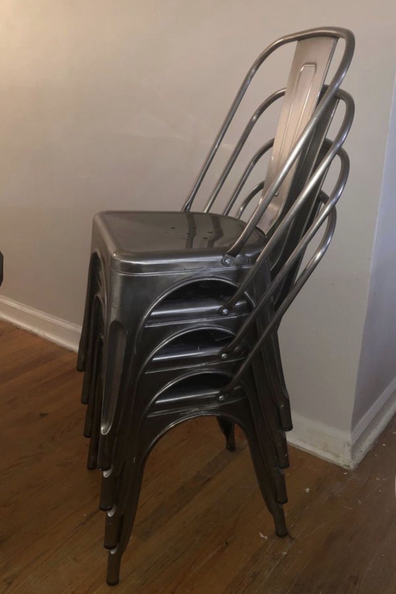 4 gunmetal stackable Chairs