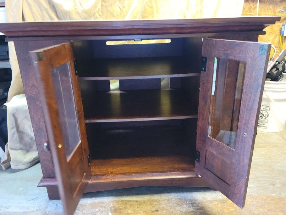 This beautiful well constructed heavy piece of furniture can be used as a entertainment center, TV stand, console table, etc.