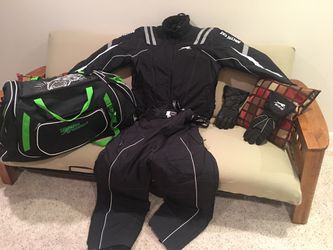 Snowmobile suite and boots and bag and gloves