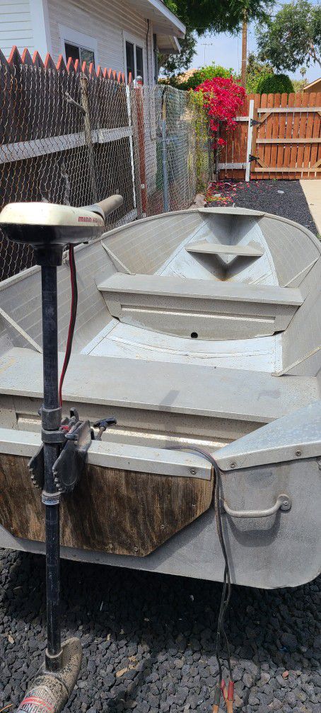 14 ft Sears aluminum boat w/folding trailer and extras.