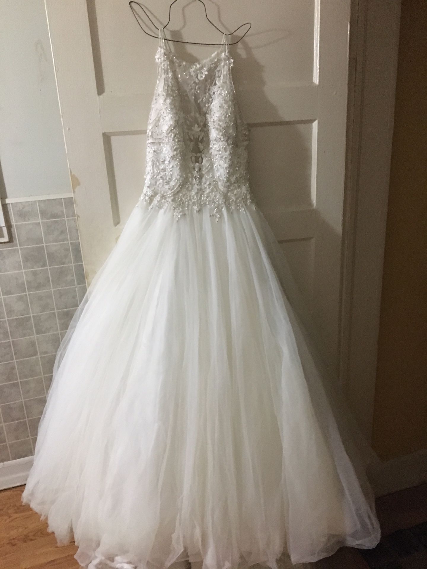 Size 8 Maggie sorrento wedding dress. Gold/ivory. Sweetheart neckline. Long train. Used in mint condition.