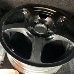 16 in rims all black spray painted Thumbnail