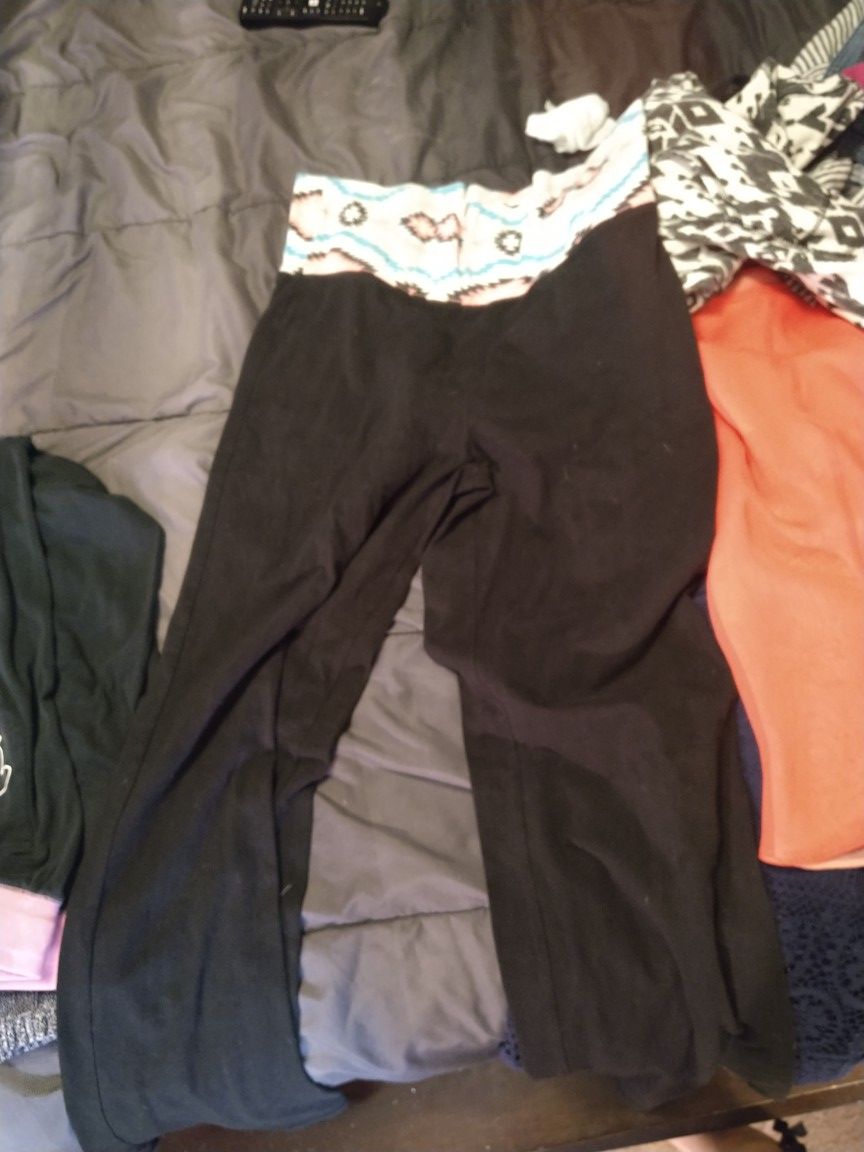 Only a few of many in a big people tub. Some large, medium, size 12-16 pants, jackets, and hooded shirts, night gowns,dresses