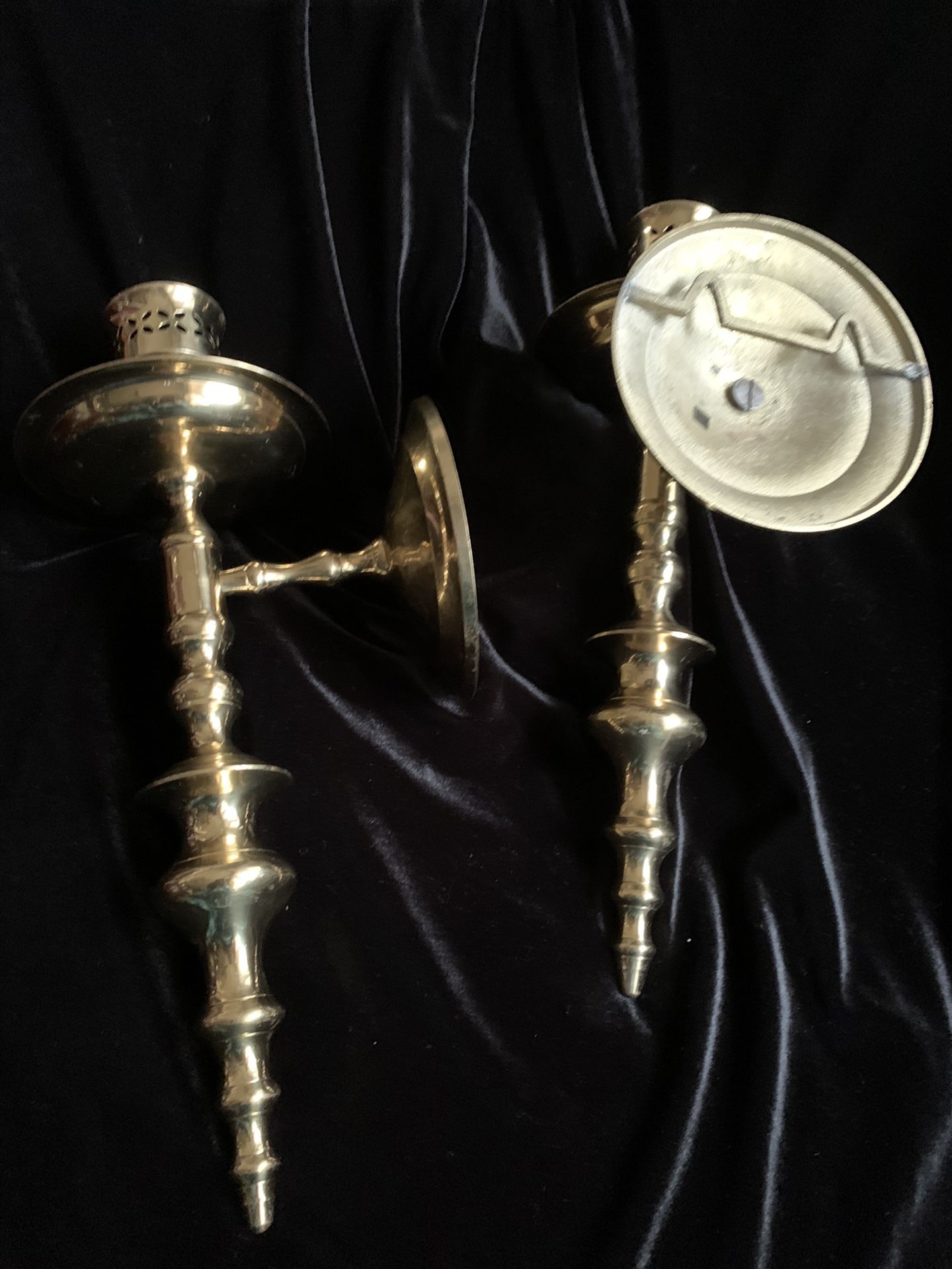 Brass wall candle holders.