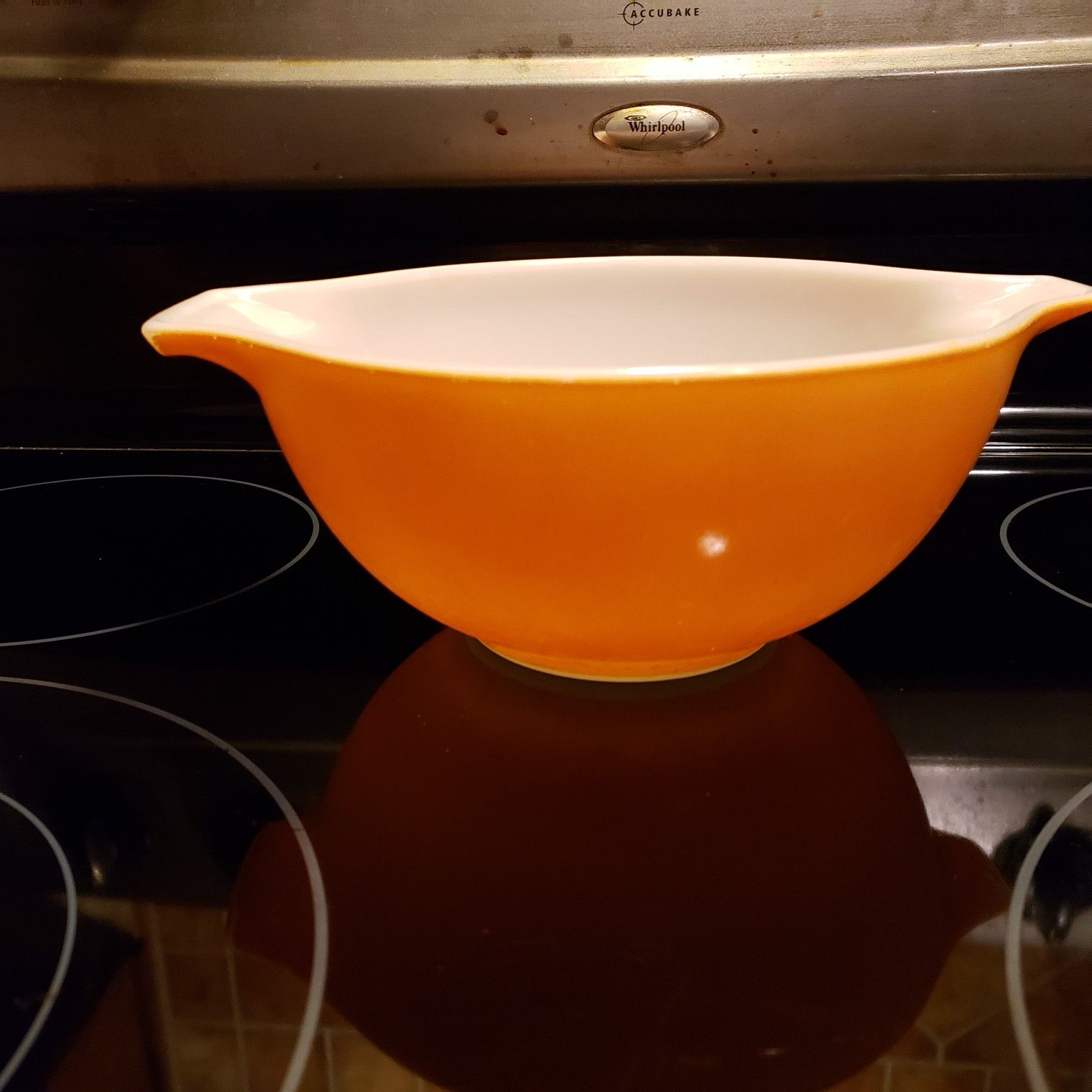 Pyrex small orange bowl..