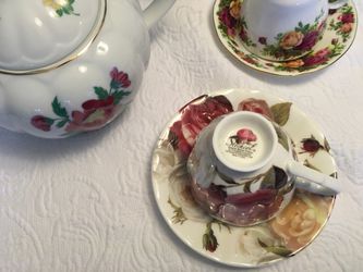 Laura Ashley China tea pot and assorted teacup and sauces ,and creamer Thumbnail