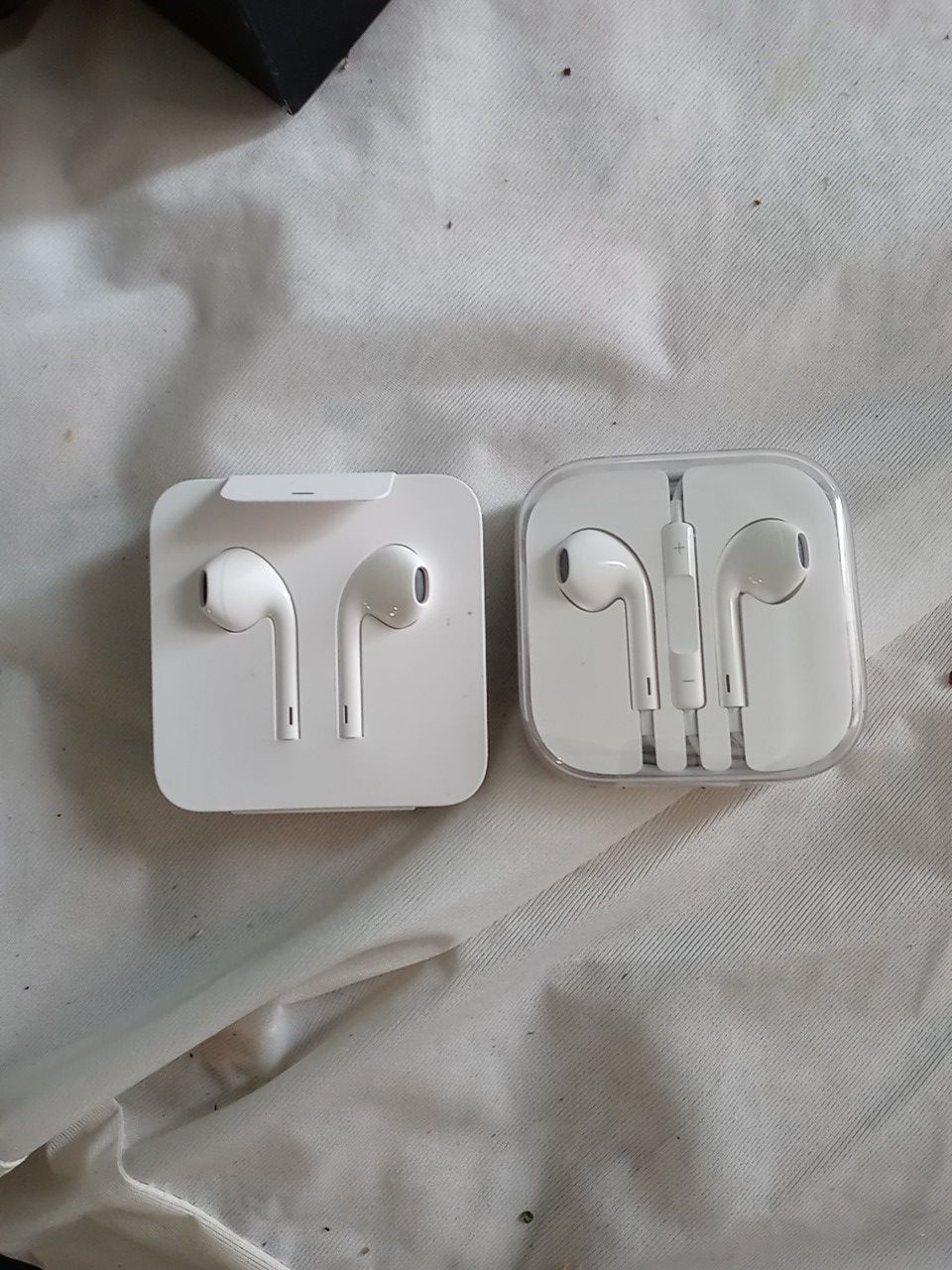 2 sets of Apple ear buds iphone and iphone 5 s