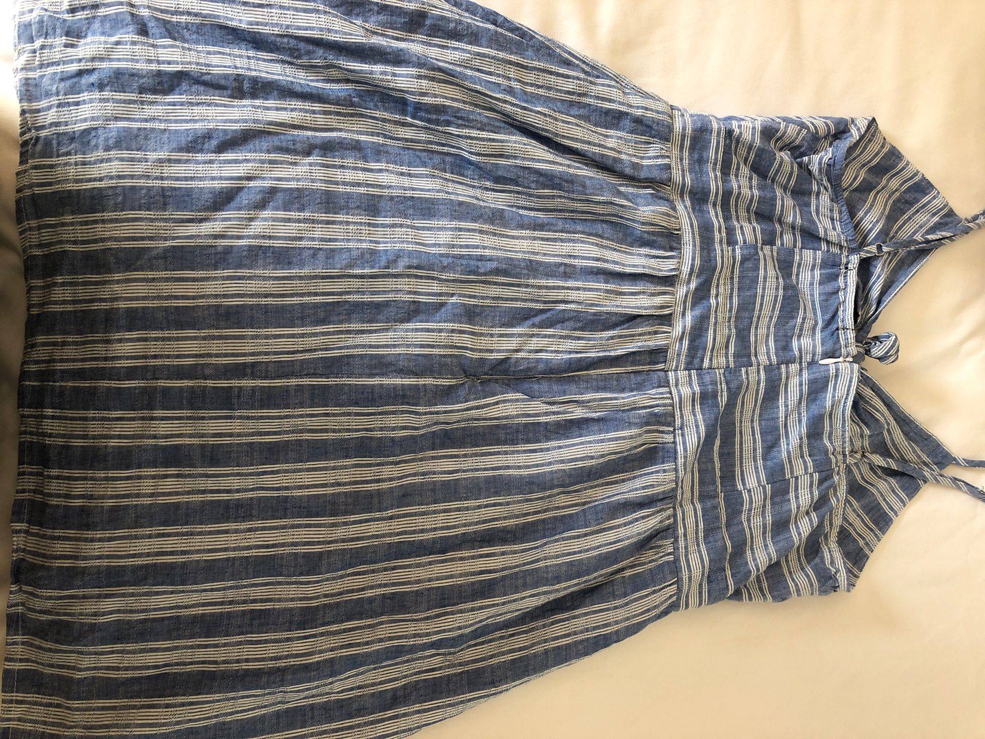 Classy or casual blue and white stripped sundress with cutout in front. Size 4-6